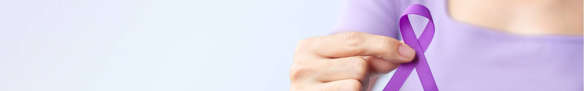 A woman holding Purple Ribbon